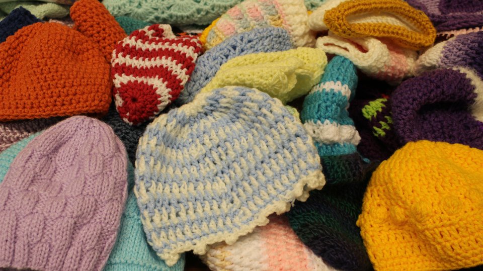 Volunteers Knit Handmade Goods For Families In Need