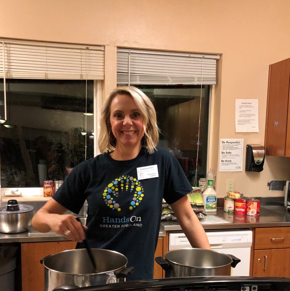 Camille Bell cooking a meal at Jean's Place.