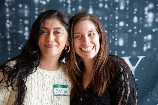 two women smile for the camera