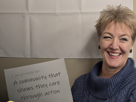 a woman holds a whiteboard