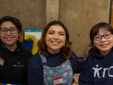 three women smile